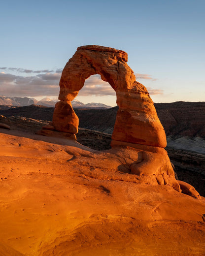 Delicate Light | Vertical Delicate Arch Print, Utah captures the iconic sandstone arch at sunset—an ideal Arches National Park print for southwest decor or as a memorable Delicate Arch photography piece.