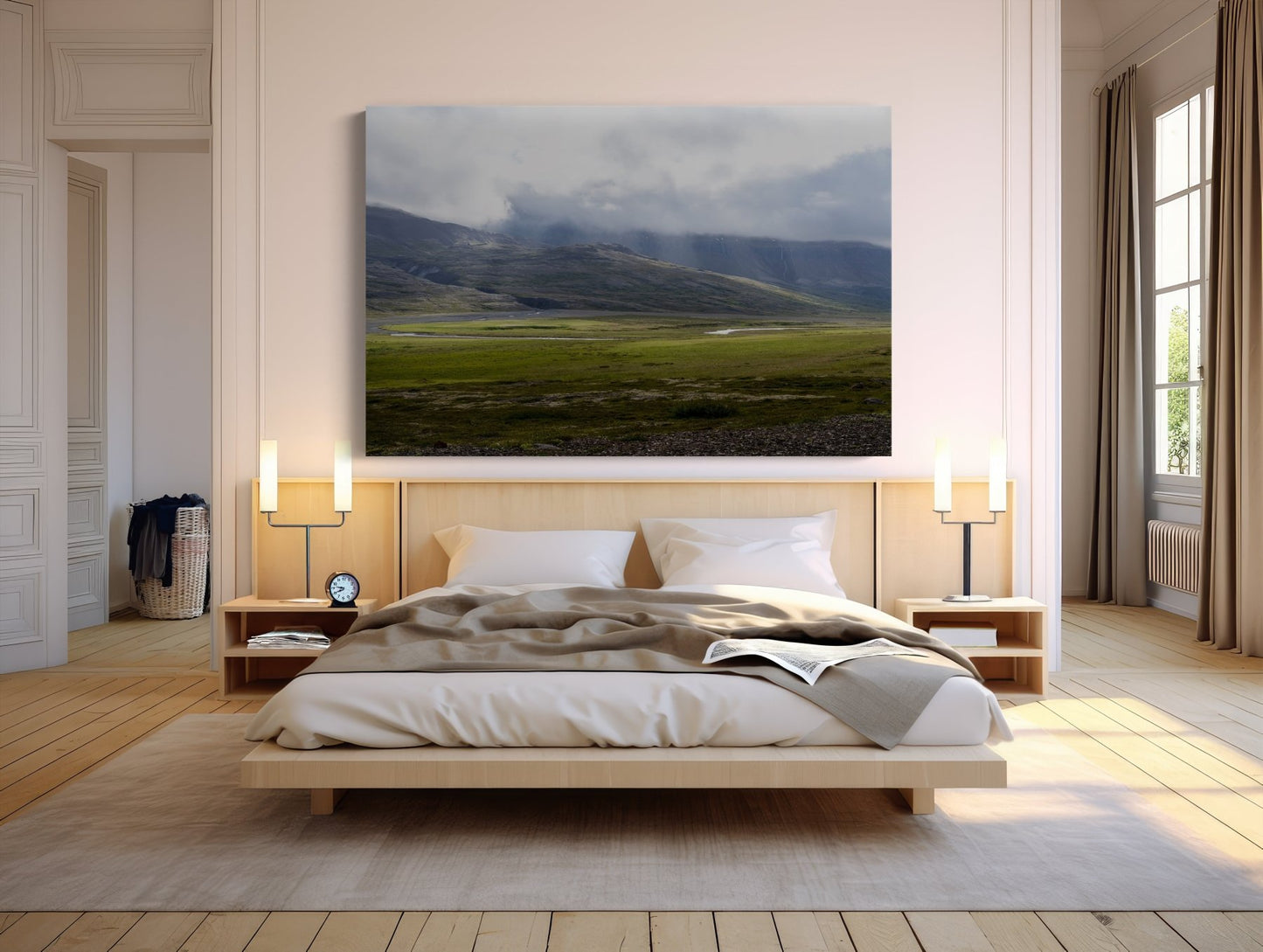 A cozy modern bedroom with a large bed, neutral bedding, bedside tables with lamps, and the Rivers of Light - Iceland Landscape Photography Print of mountains above the headboard. Sunlight streams through tall windows with beige curtains.