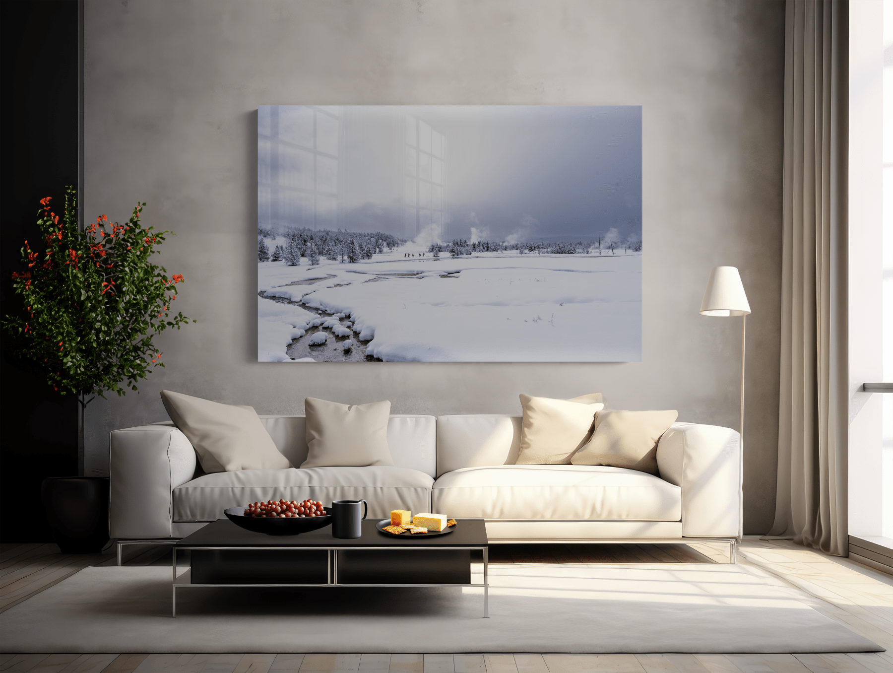 A modern living room with a white sofa, neutral pillows, a black coffee table, a floor lamp, and "Worth the Rest - Yellowstone Winter Photography Print" as nature wall art above the sofa. A leafy plant sits in the corner.